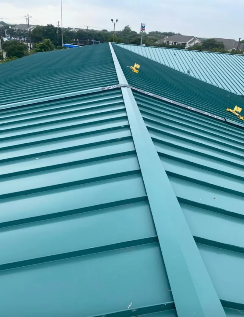 Green commercial metal roof ridge and valley for Metal Roof Repair in Weston